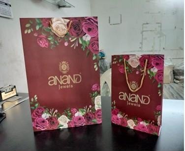 Two floral-printed premium bags for Anand Jewels