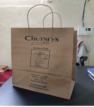 Brown kraft handle bag printed for Chutneys Bistro