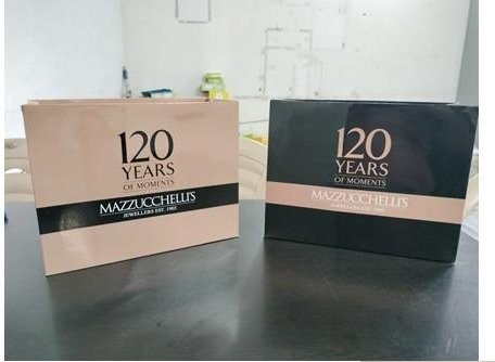 Blush and black laminated premium bags for Mazzucchelli's 120 Years
