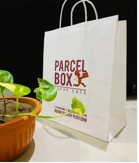 White handle bag printed for Parcel Box Popup Eats