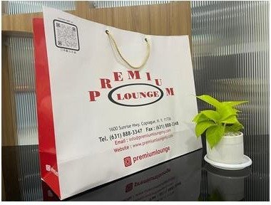 White premium bag with gold rope handles printed for Premium Lounge